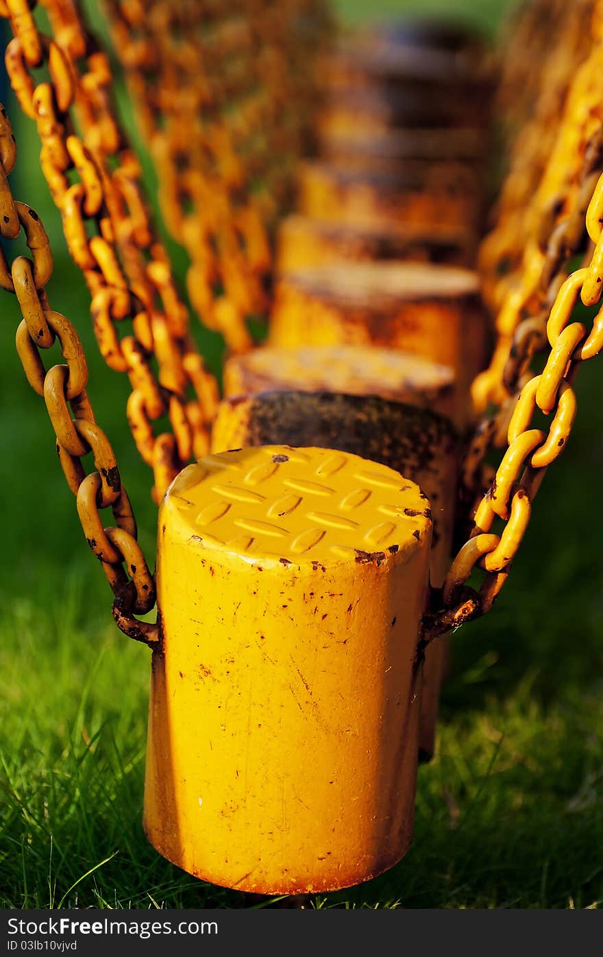 The yellow chains on the green blackgruond