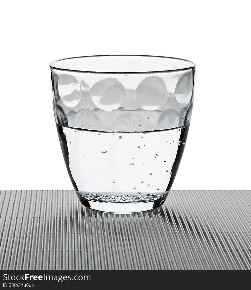 Water on a glass on white background