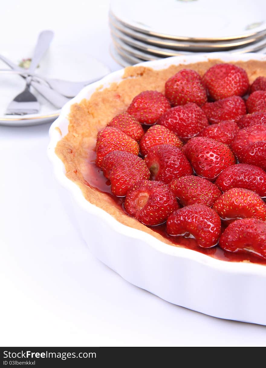 Strawberry Tart, plates and forks, on a white background