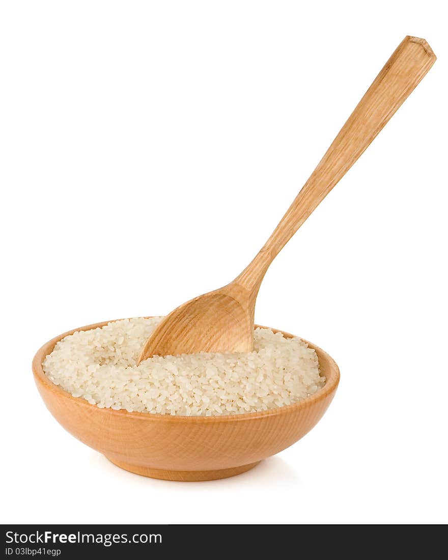 Rice in wooden plate and spoon isolated on white background