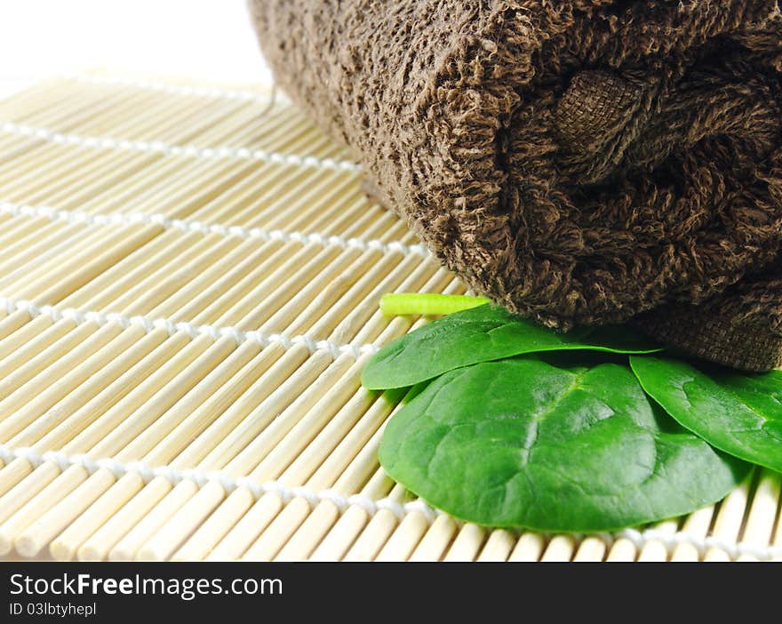 Spa towel with leaves closeup. Spa towel with leaves closeup