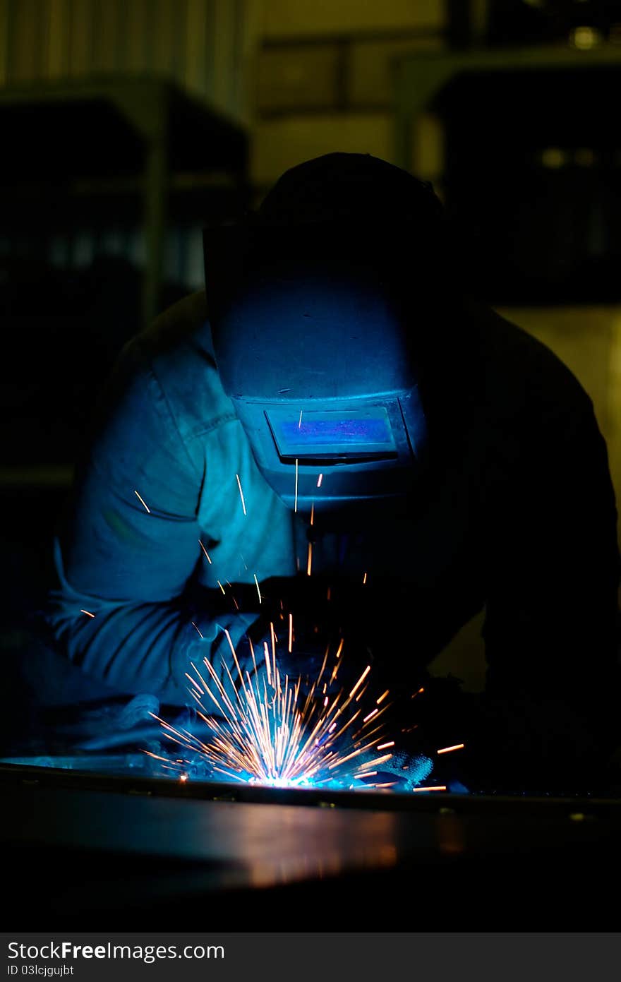 Photo of the welding process with sparks flying around. Photo of the welding process with sparks flying around