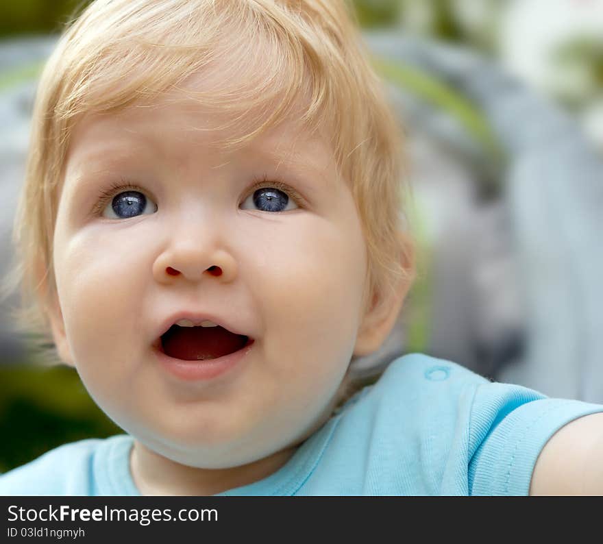 Portrait of a smiling blue eyed blond little boy. Portrait of a smiling blue eyed blond little boy