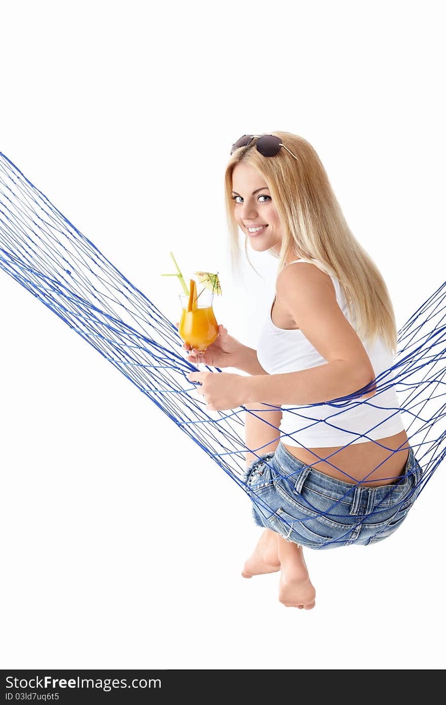 Attractive girl with a cocktail in a hammock isolated. Attractive girl with a cocktail in a hammock isolated