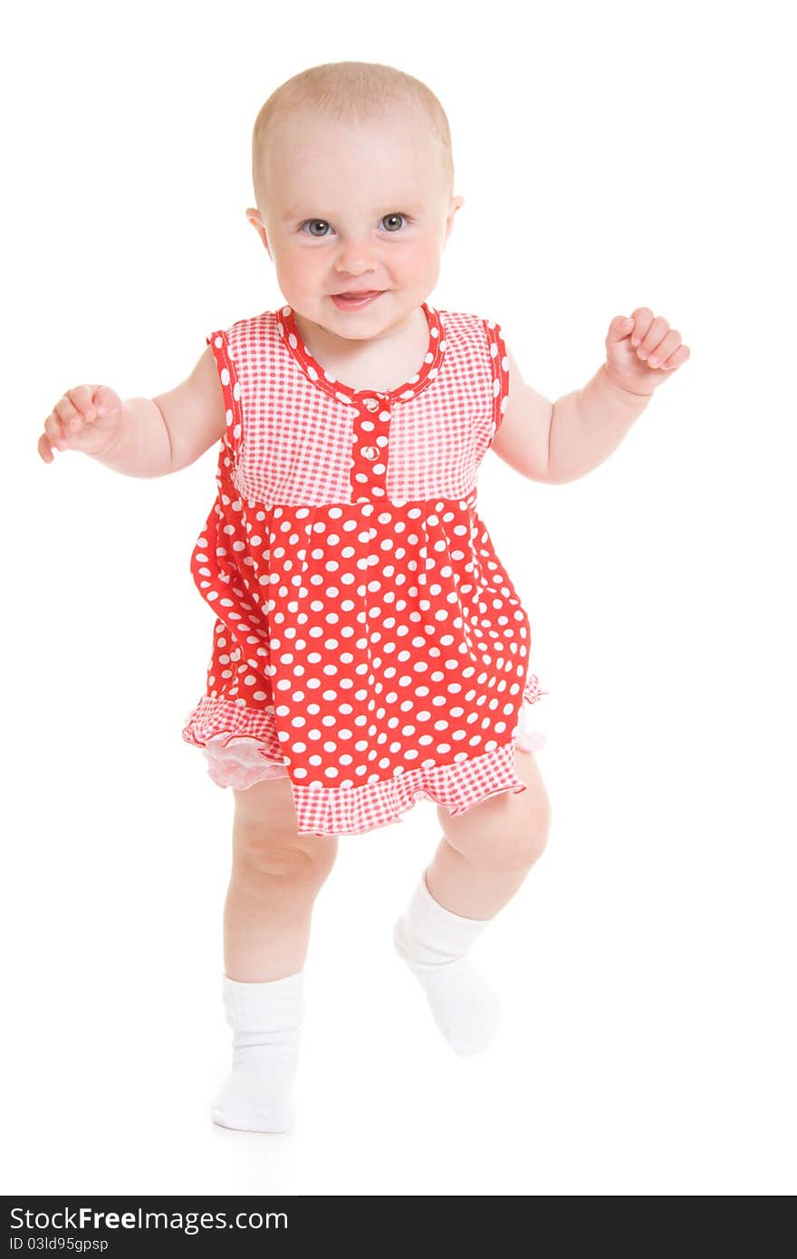 Baby in dress on a white background.