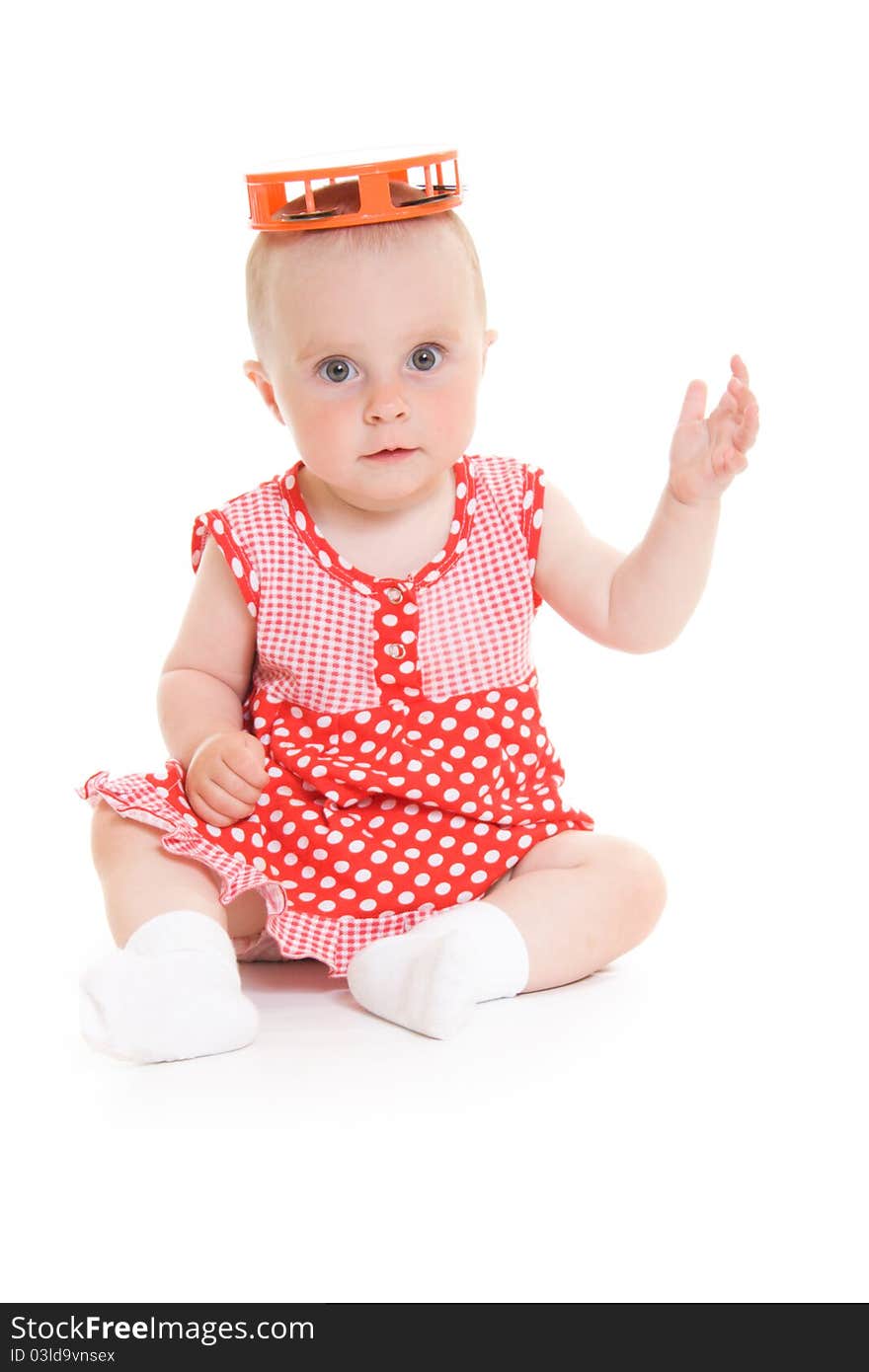 Baby in dress on a white background.