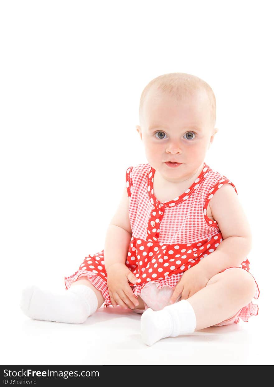 Baby in dress on a white background.