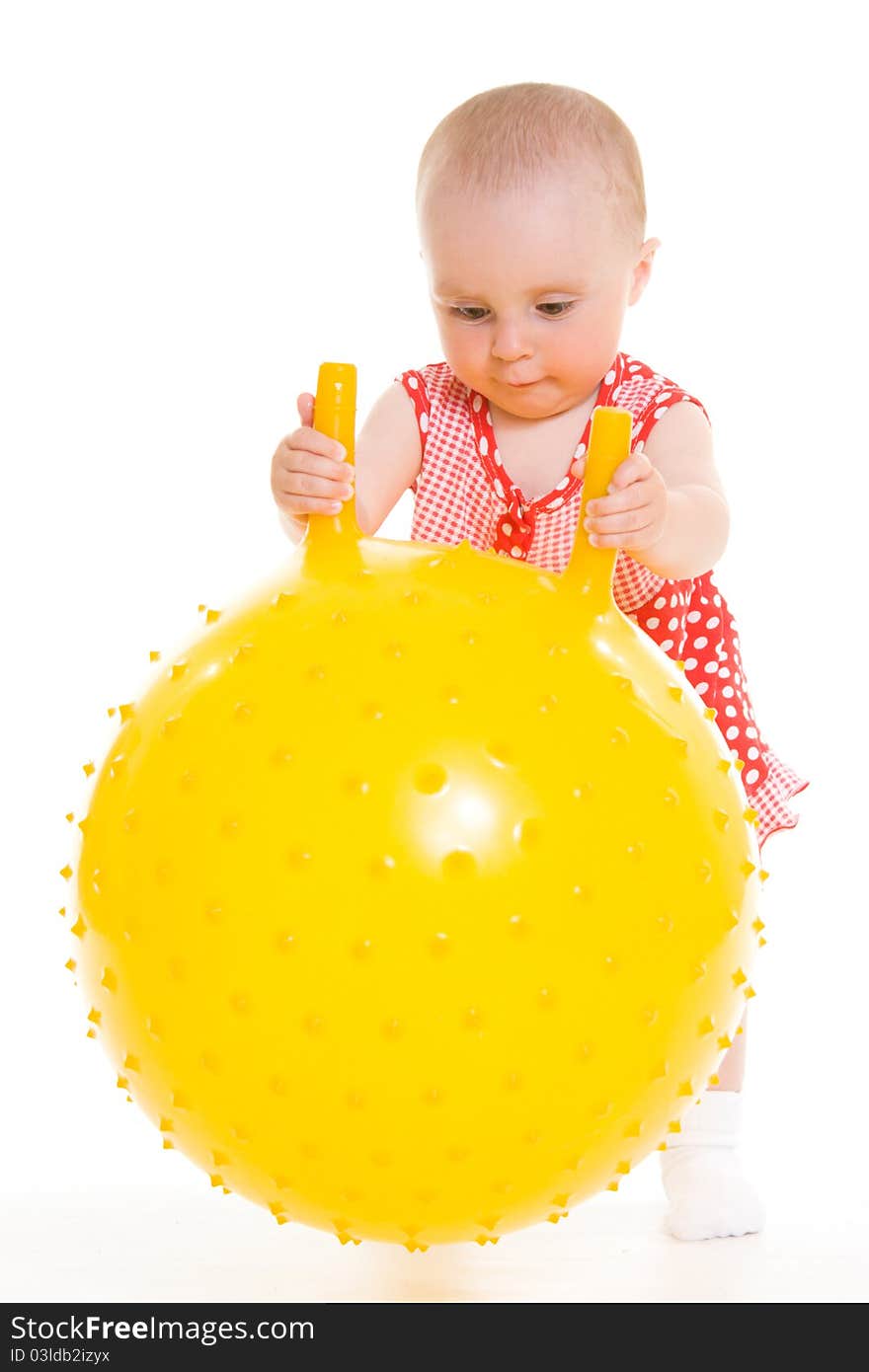 Baby in dress on a white background.