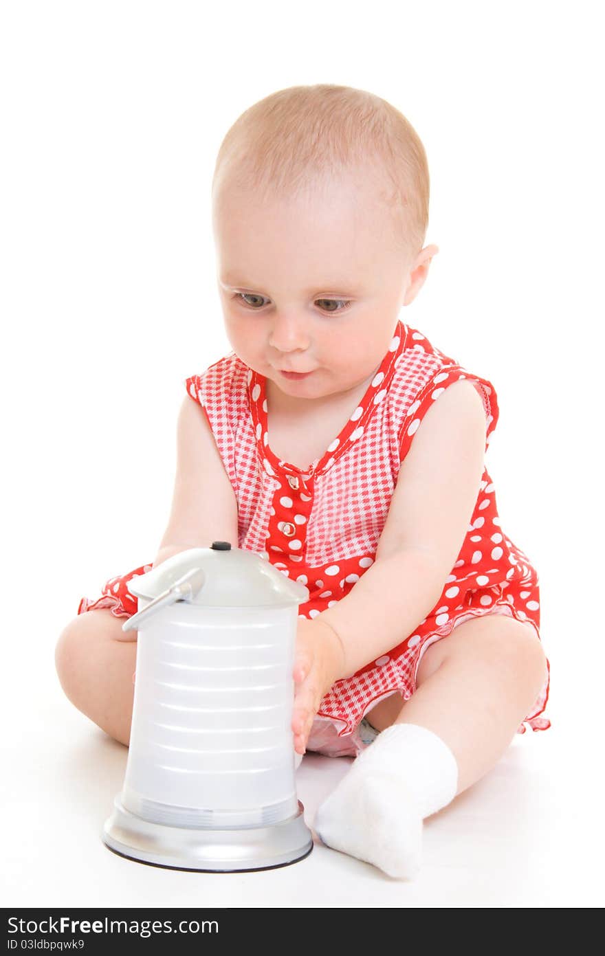 Baby in dress on a white background.