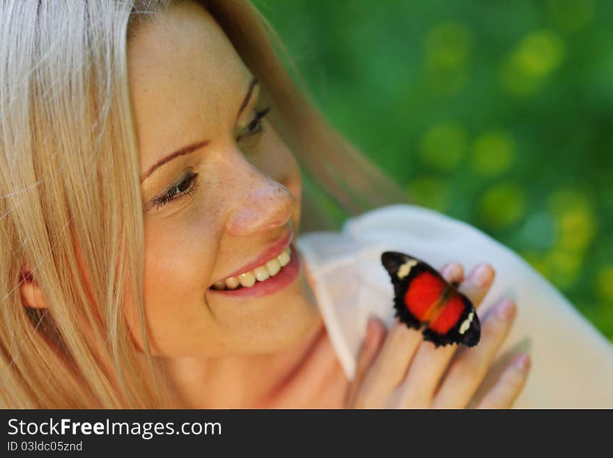 Woman playing with a butterfly