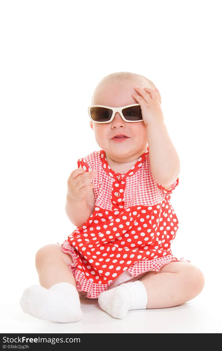 Baby in dress on a white background.