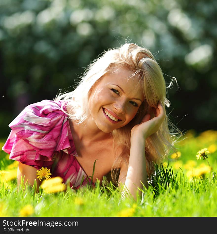 Girl on dandelion field