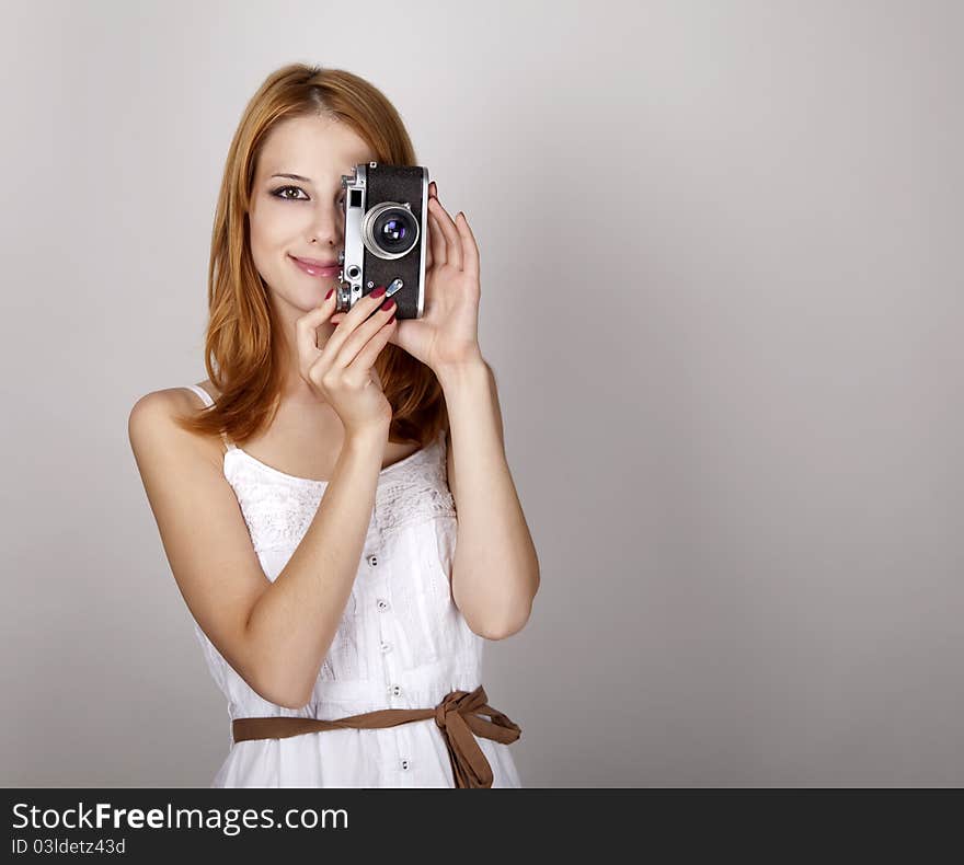 Girl In White Dress With Vintage Camera.