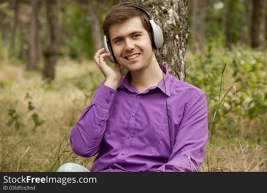 Men with headphones at the park