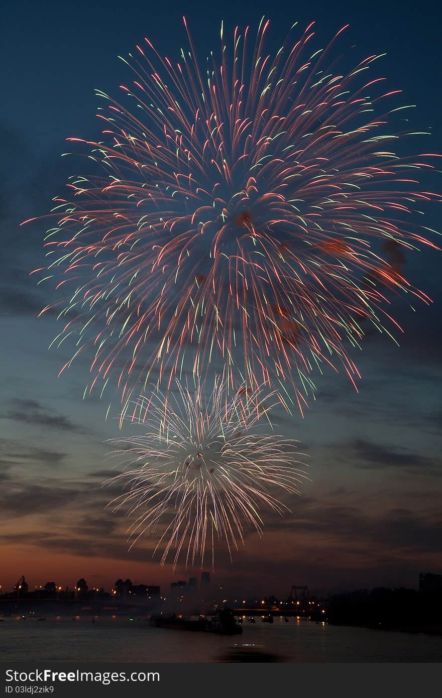 Colorful fireworks in the night sky with reflection on water. Colorful fireworks in the night sky with reflection on water.