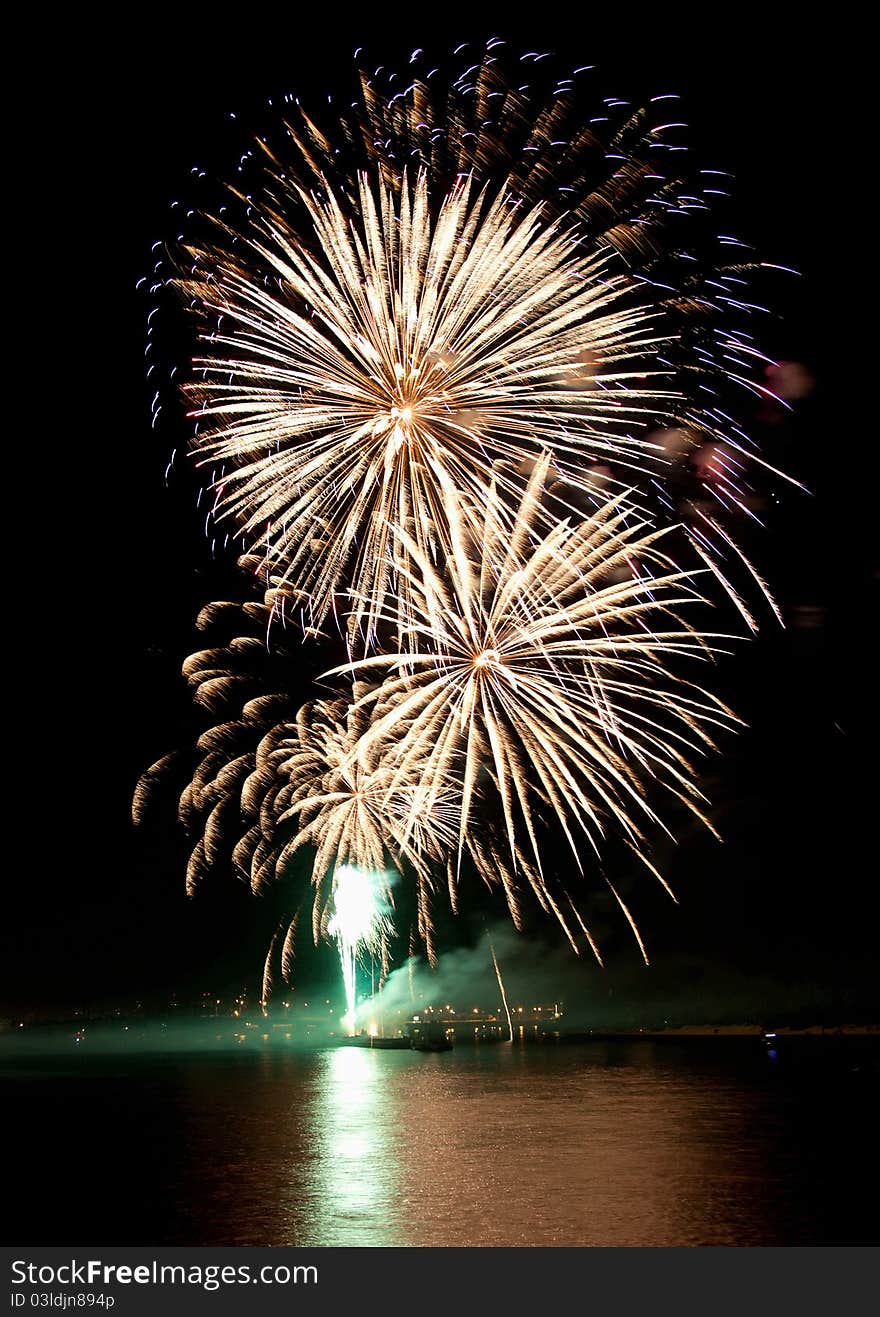 Beautiful colorful fireworks in night sky with reflection on water. Beautiful colorful fireworks in night sky with reflection on water.