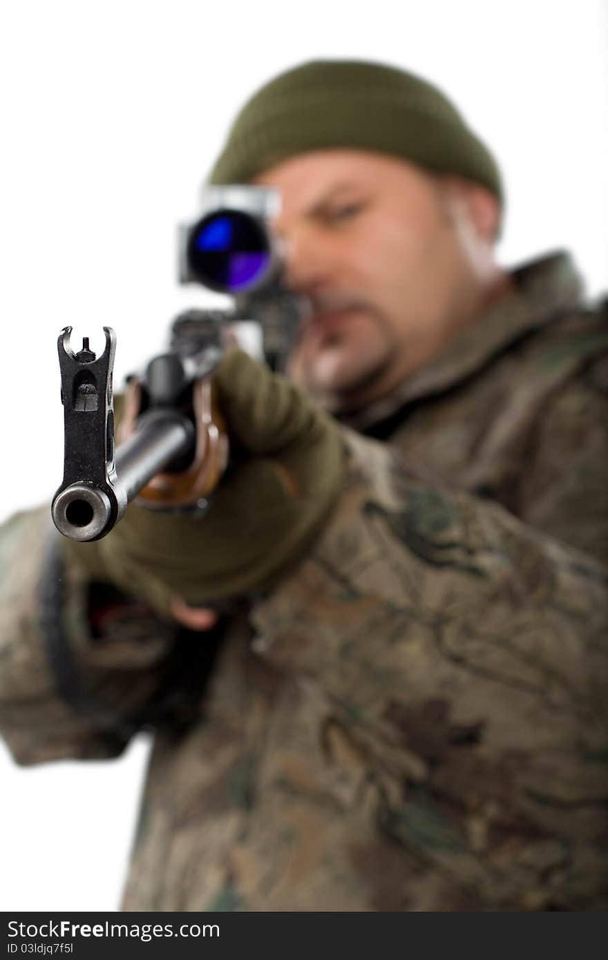 Portrait of a man with a gun on white.