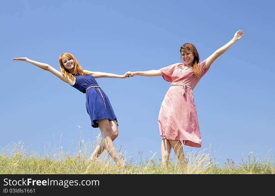 Happy Girls At Meadow.