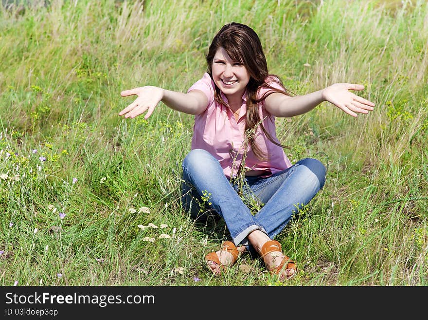 Girl at green grass.