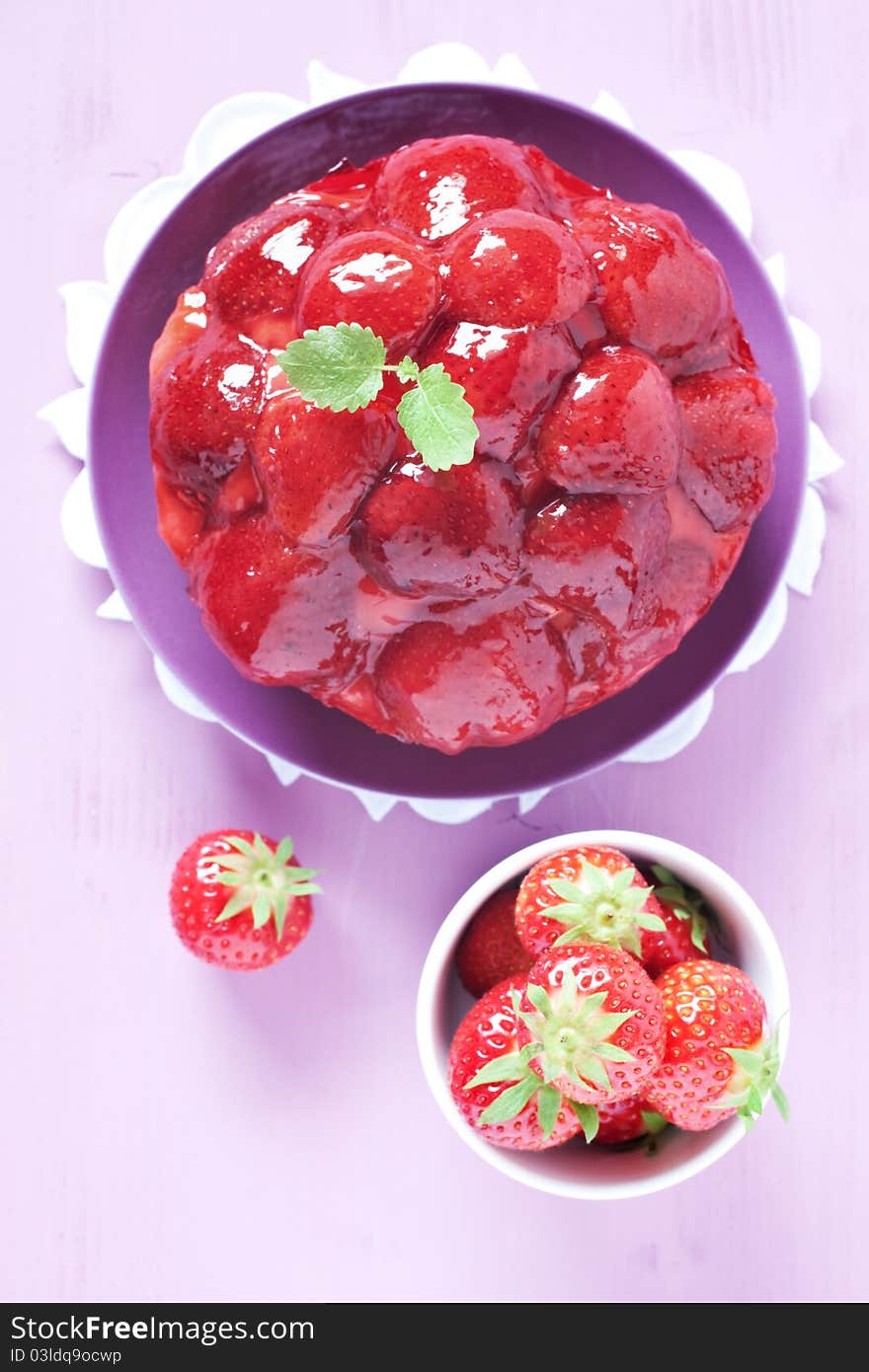 Strawberry tart and strawberries on table