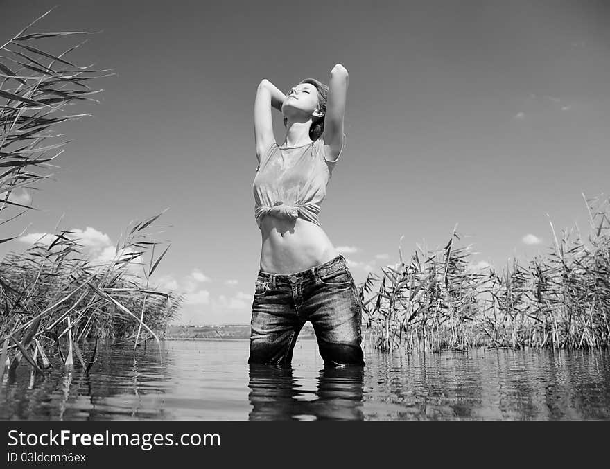 Beautiful savage girl in the river.