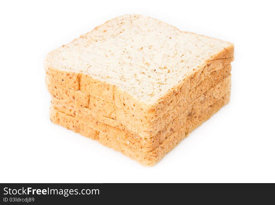 Stack of whole wheat bread on white background