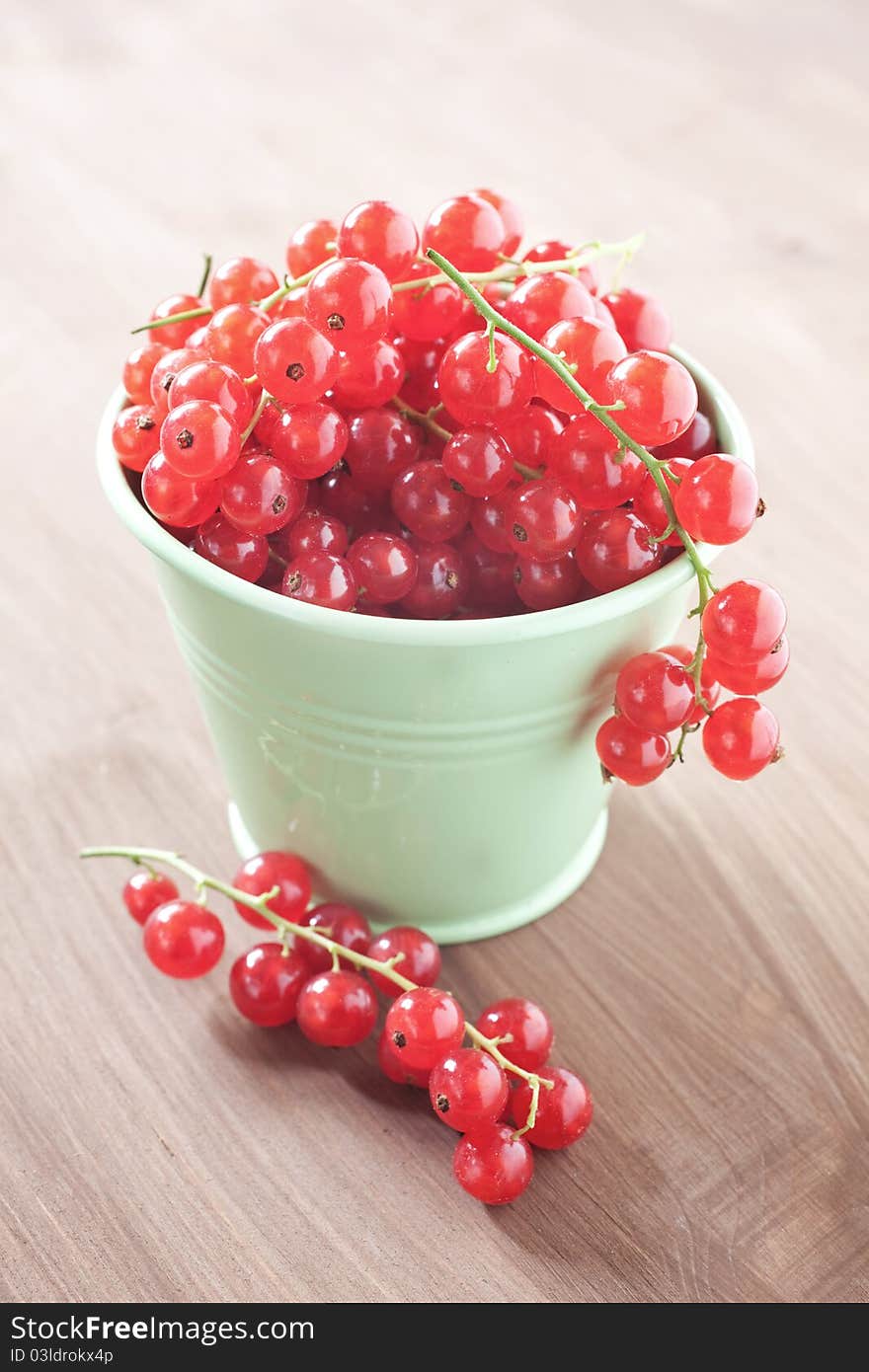 Fresh redcurrants in a bucket