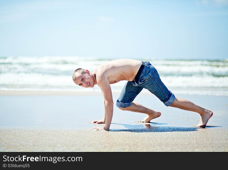 Handsome man on the sanny beach. Handsome man on the sanny beach