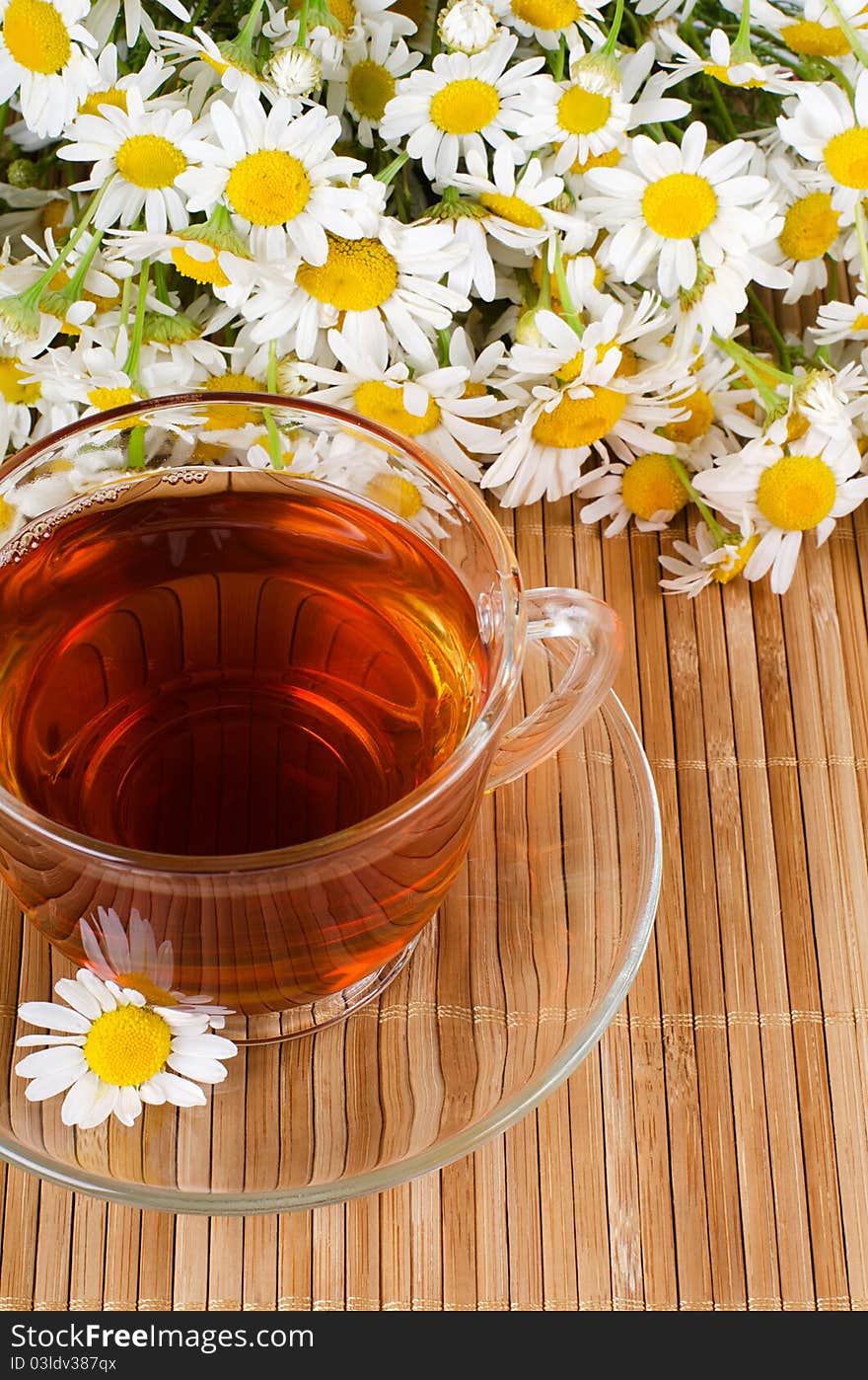 Glass Cup With A Camomile Tea