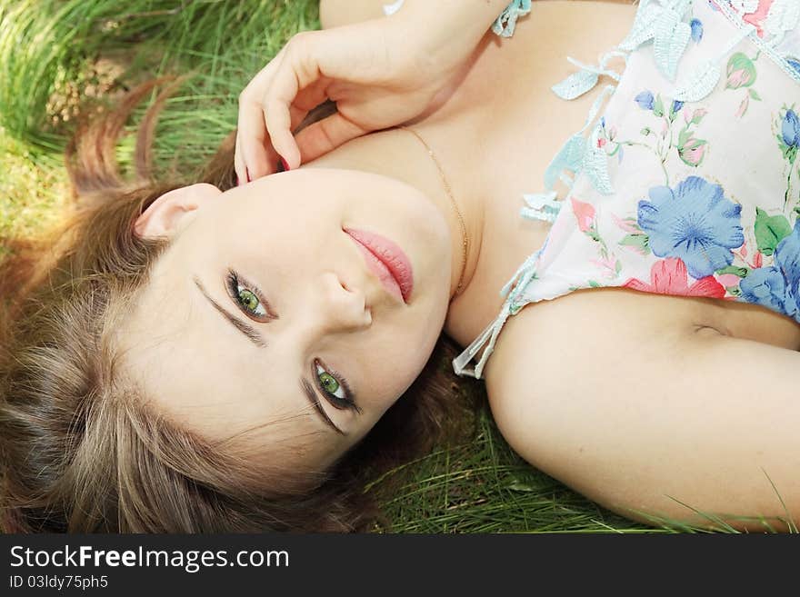 Girl Lies On Grass