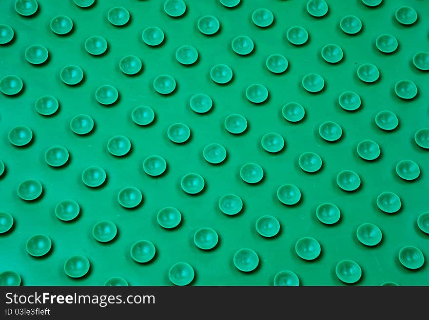 Green plastic surface pattern.