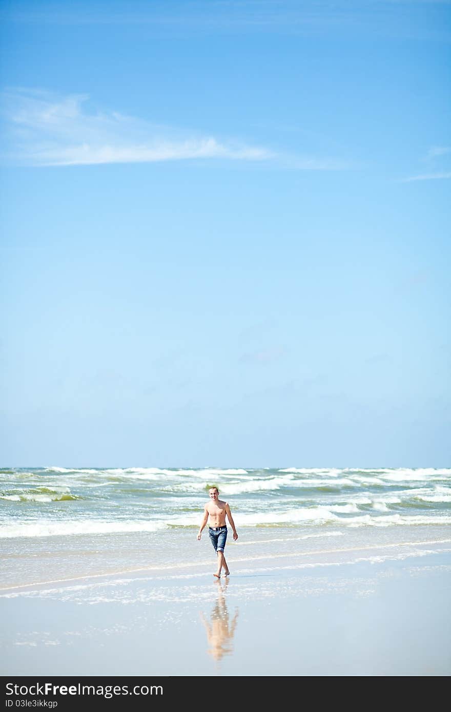 Young gay on the beach. Young gay on the beach