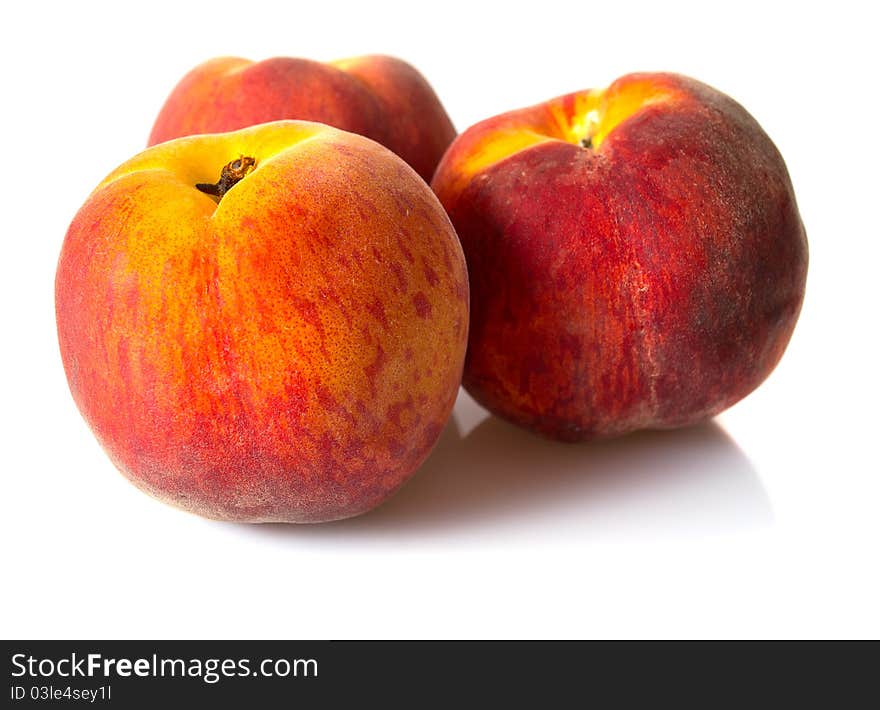 Fresh peaches isolated on white