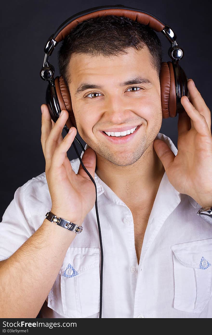 Handsome Man Enjoying Music On Headphones