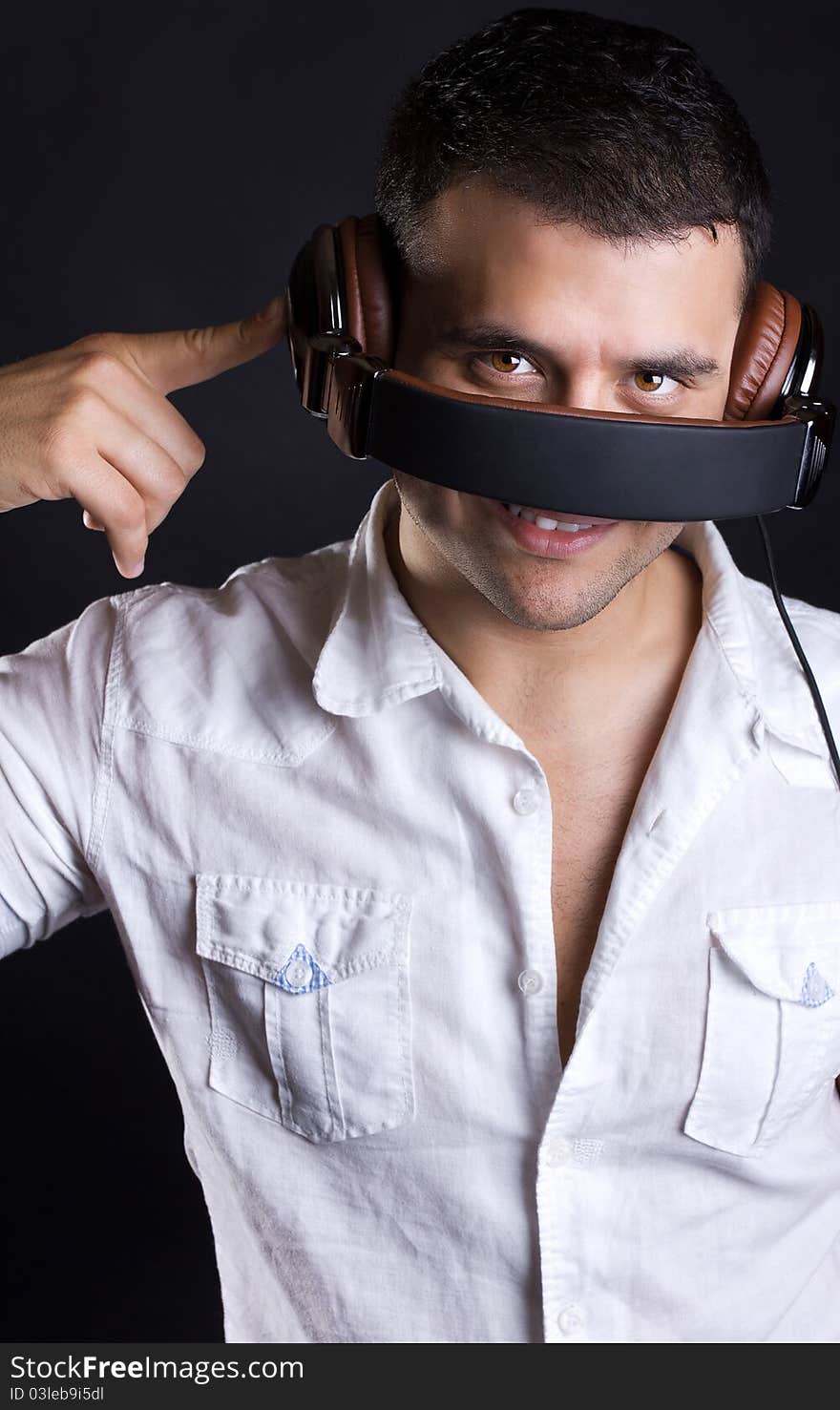 Handsome man enjoying music on headphones. Handsome man enjoying music on headphones