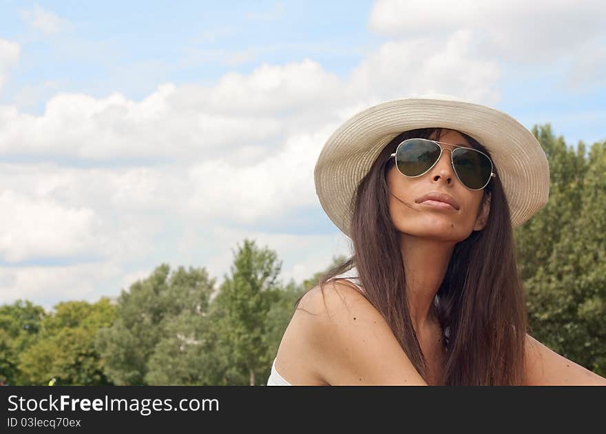 Beautiful woman in a park on a summer day