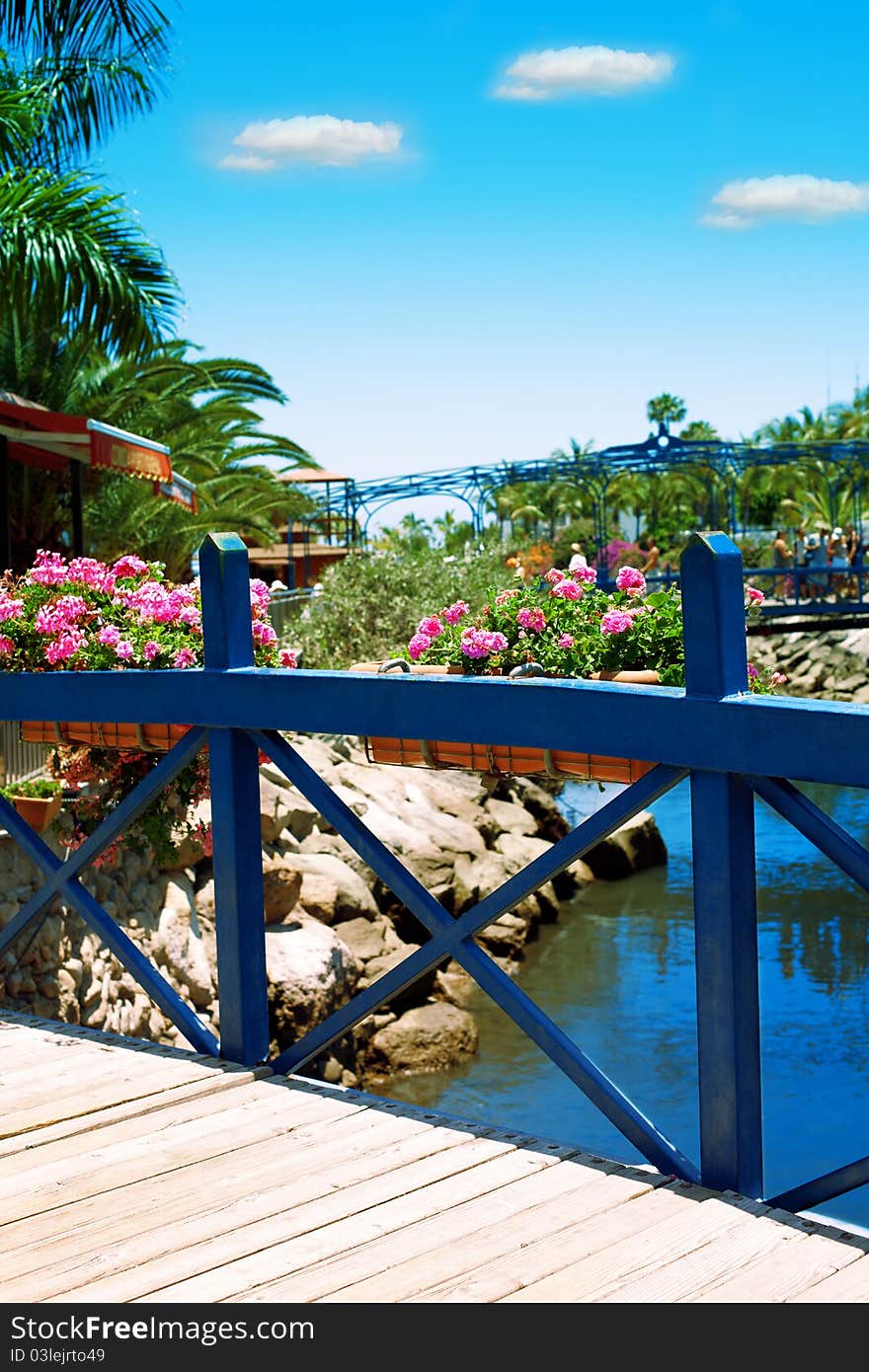 Narrow Wooden Bridge Over A Canal