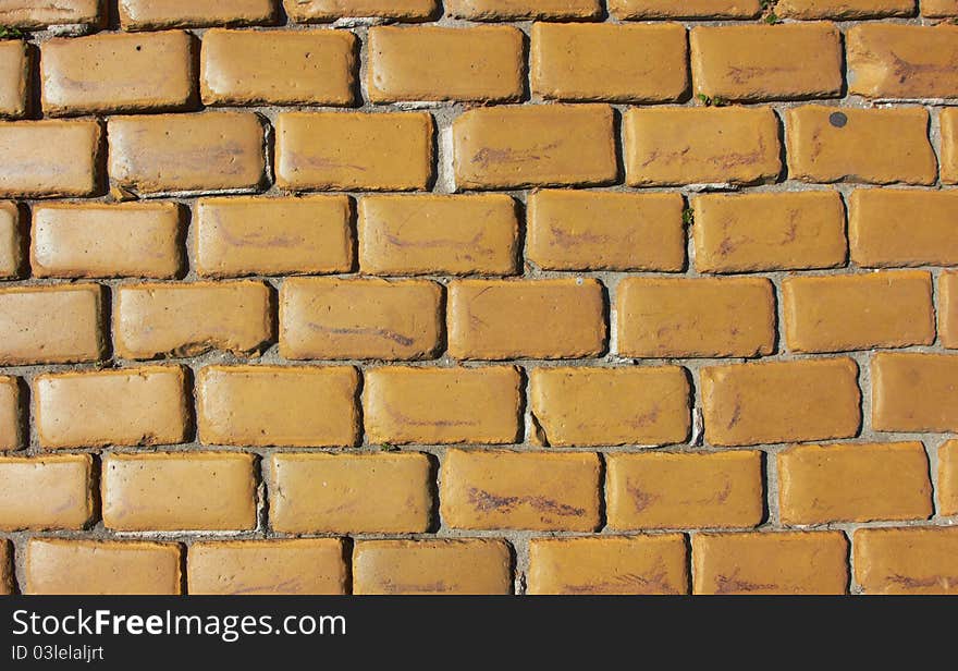 Old wall made from yellow bricks texture