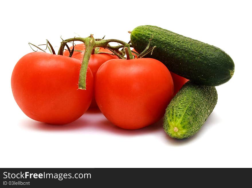 Foto of cucumbers  and tomatoes in room