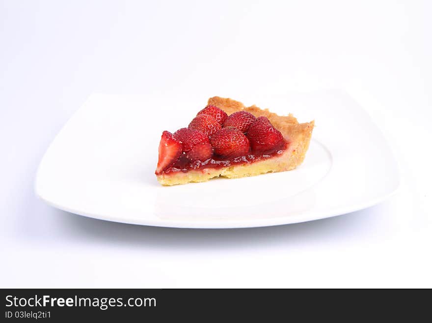 Strawberry Tart portion on a white background