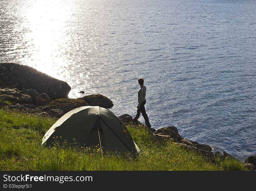 Young woman standing on sea edge