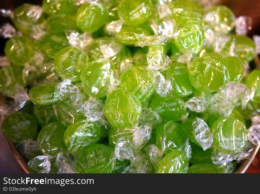 Tart sour apple green hard candy at a old fashioned candy store. Tart sour apple green hard candy at a old fashioned candy store.