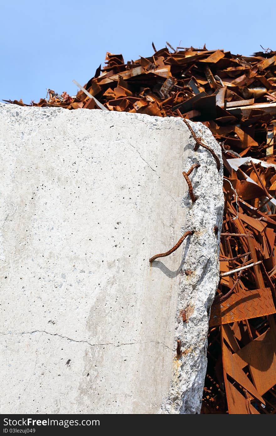 Pile of scrap metal and concrete block. Pile of scrap metal and concrete block