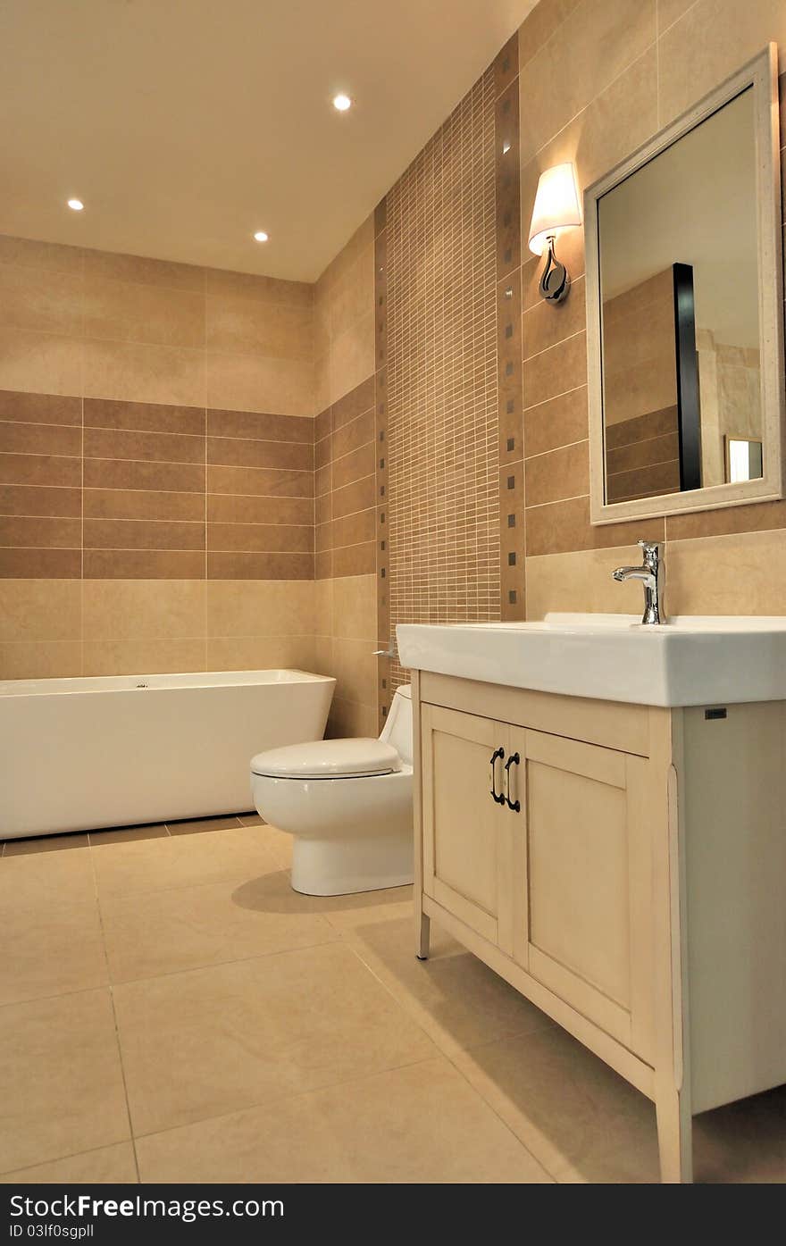 Washroom with bathtub, closestool, water closet and mirror, shown as functional place and setting in house, and comfortable life style. Washroom with bathtub, closestool, water closet and mirror, shown as functional place and setting in house, and comfortable life style.