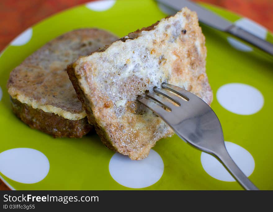 Fried toast on a fork. Fried toast on a fork