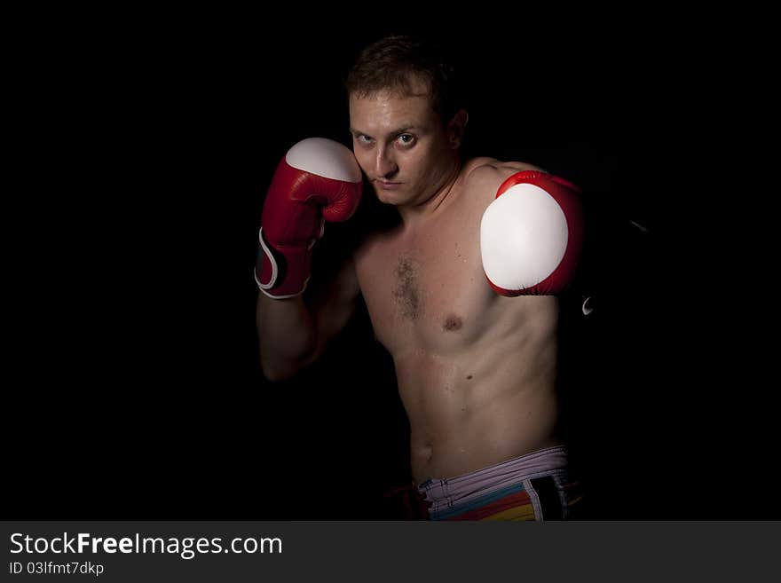 Young Boxer Over Black Background