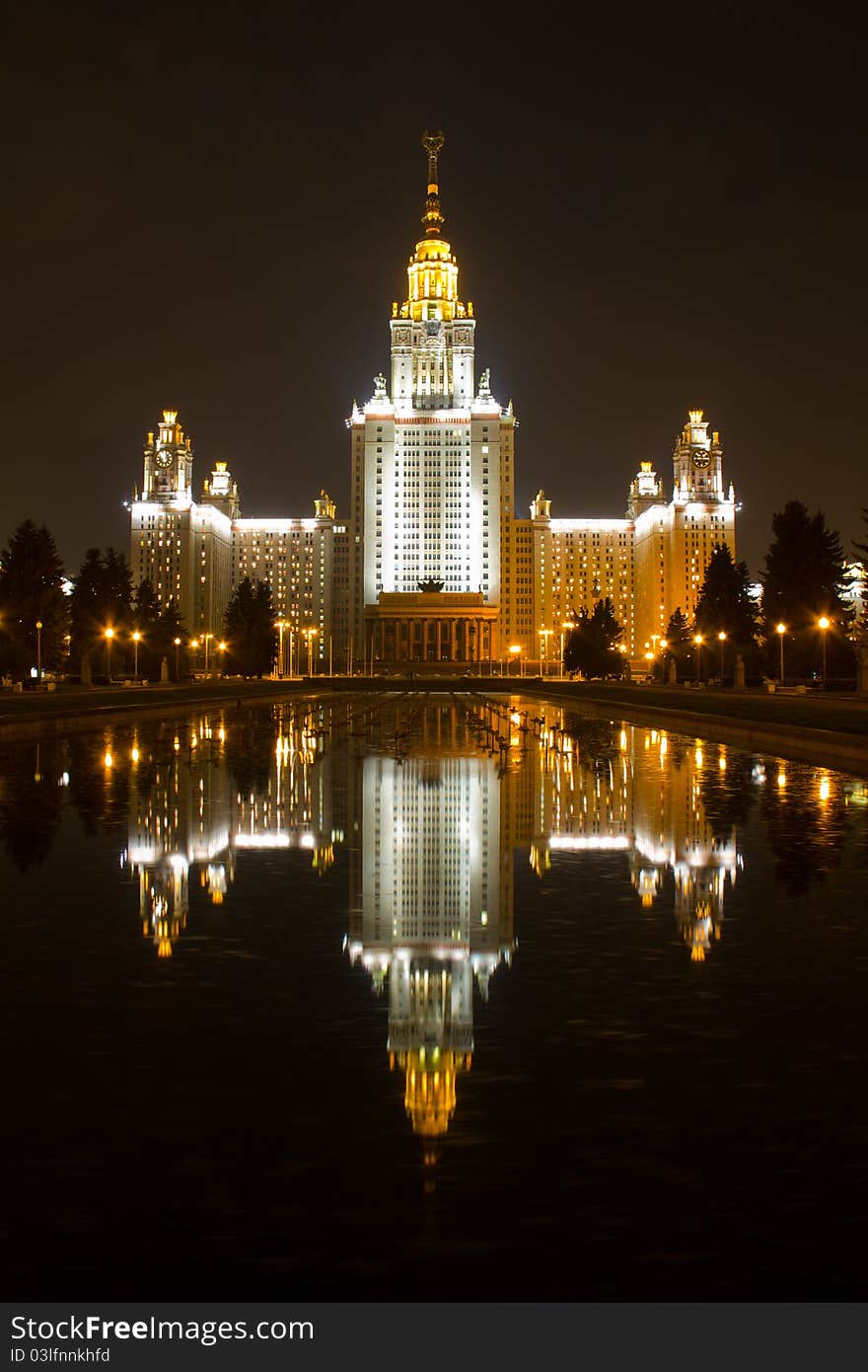 Moscow State University in night with reflection on dark water