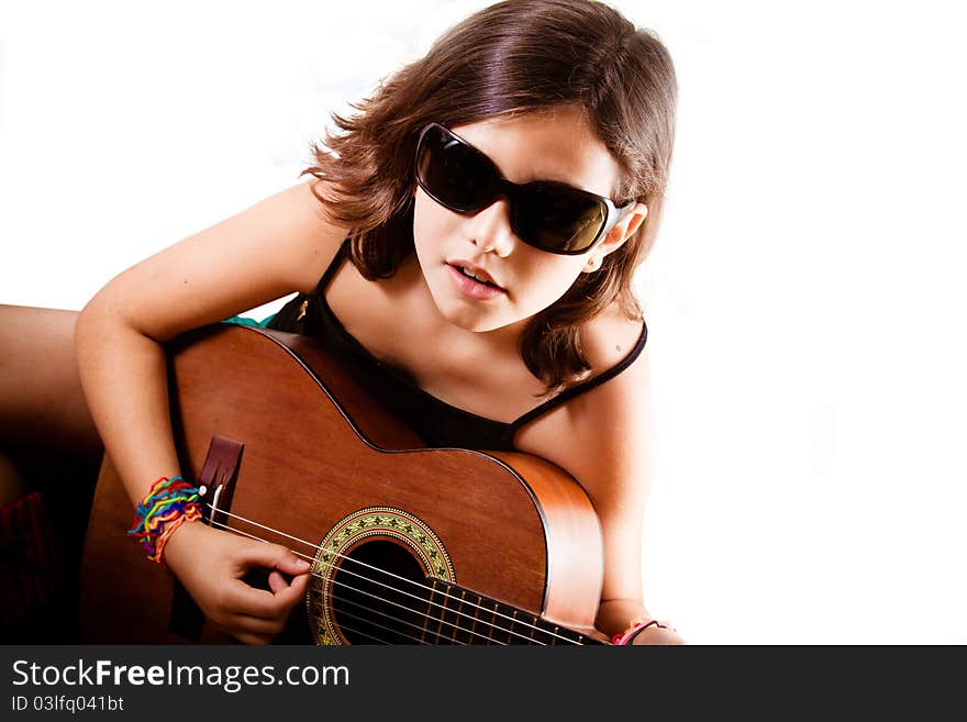 Young girl playing guitar, landscape