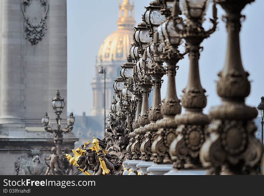 Lampposts on the bridge and the golden Dome of the Cathedral. Lampposts on the bridge and the golden Dome of the Cathedral