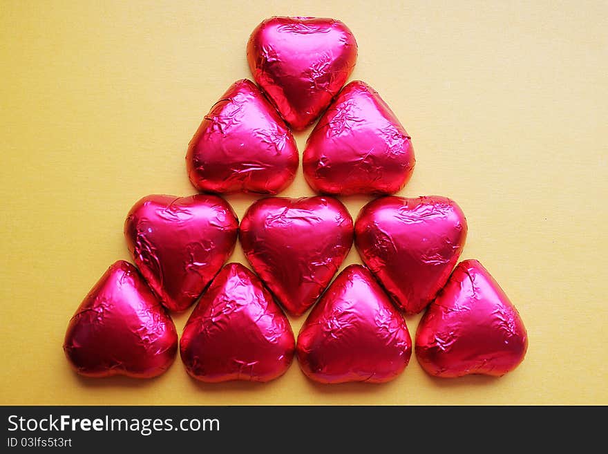 Chocolate candy hearts in a pink foil